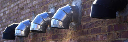 Expert Dryer Vent Cleaning | Professional Laundromat Team Image showing dryer vents of a laundromat. Power HVAC Services give thorough cleaning of dryer vents of coin laundry.