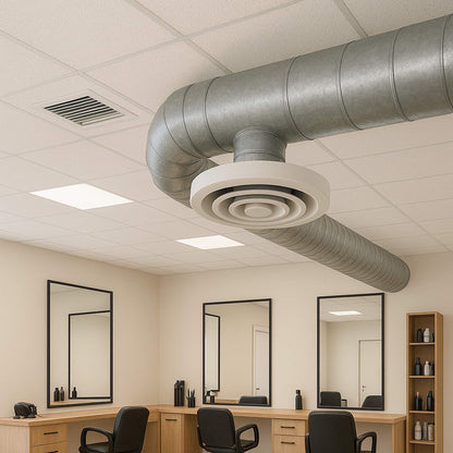 Commercial HVAC & Air Duct Cleaning,  Commercial Air Duct Cleaning Ceiling with ductwork and lighting fixtures above a vanity area with mirrors and chairs. Duct work of salon done by Power HVAC services.